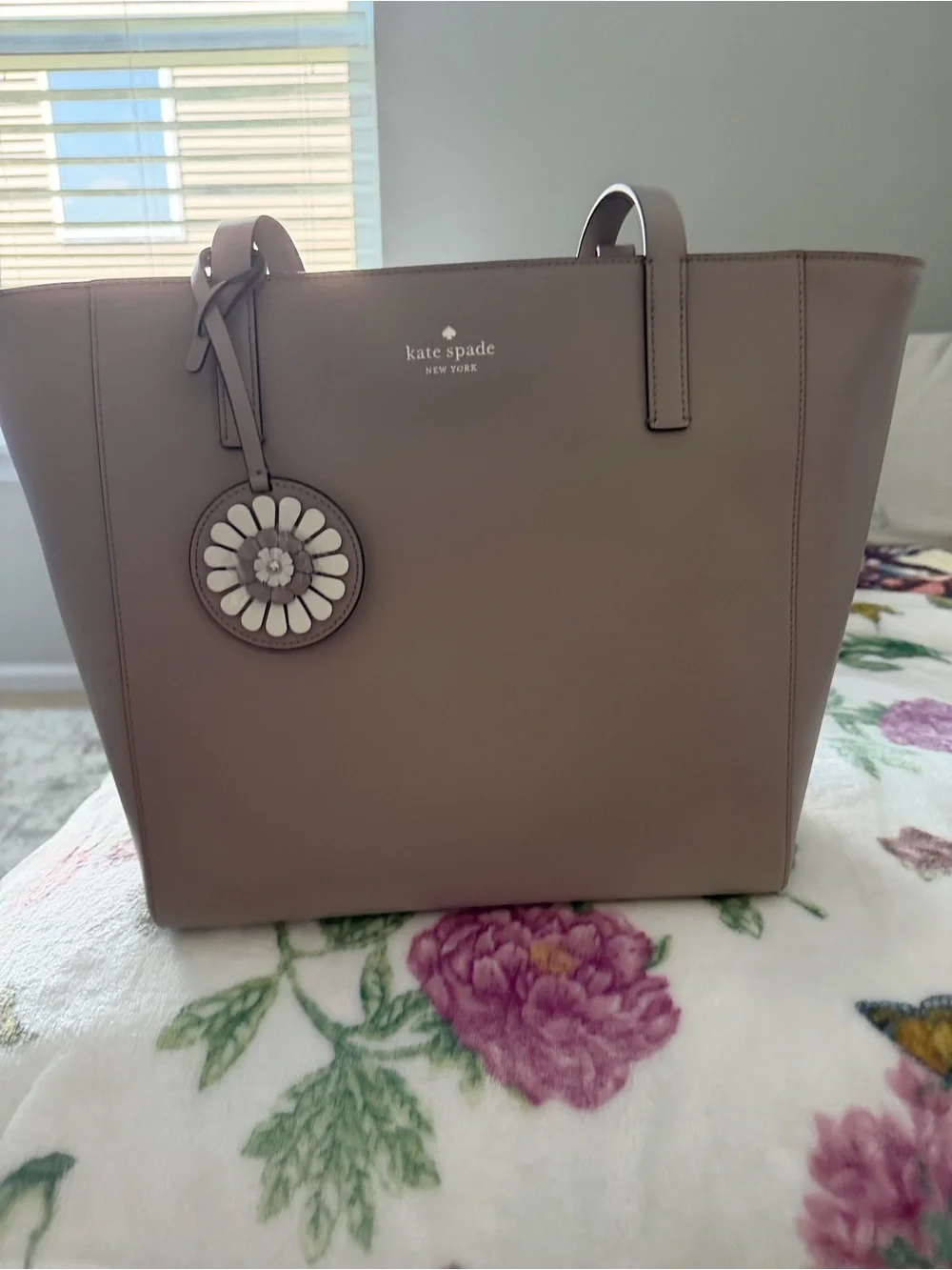 kate spade taupe leather tote with floral charm